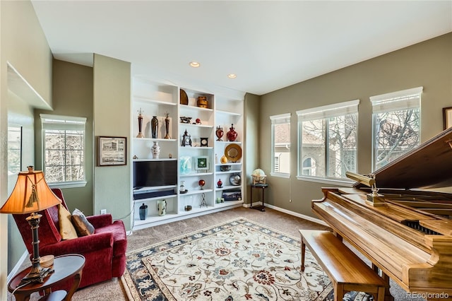 sitting room with baseboards, carpet flooring, and recessed lighting