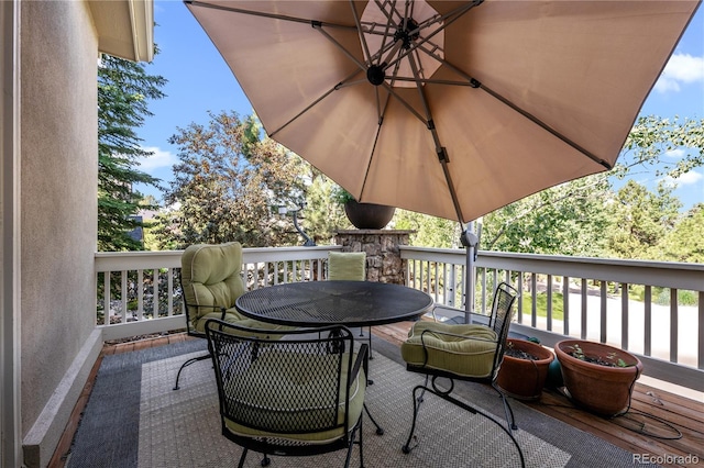 deck with outdoor dining area