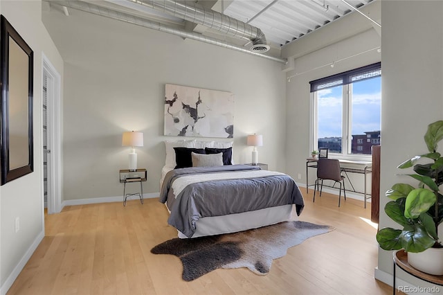 bedroom with light hardwood / wood-style flooring