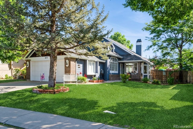 4218 E Flanders St, Denver, CO 80249 - view of front facade with brick siding, a chimney, concrete driveway, and an attached garage