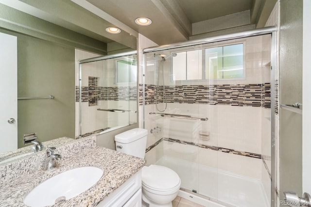 4218 E Flanders St, Denver, CO 80249 - bathroom featuring recessed lighting, a shower stall, and vanity