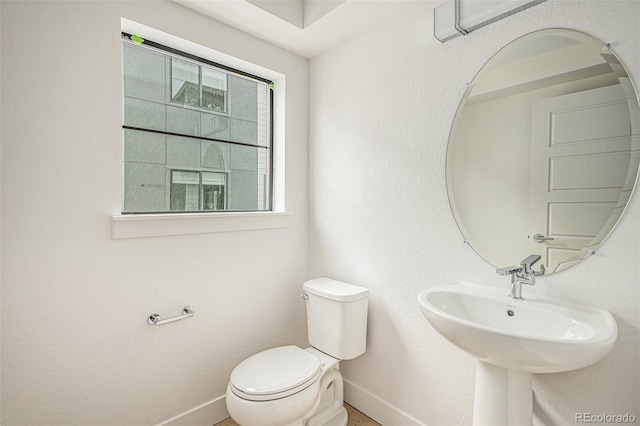 bathroom with toilet and sink