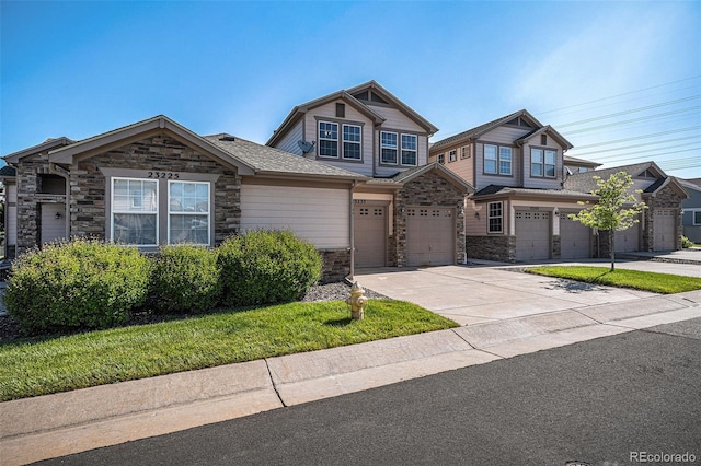 23235 York Ave, Parker, CO 80138 - view of front of house with stone siding, driveway, and a garage