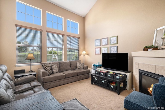 23235 York Ave, Parker, CO 80138 - living room with carpet flooring, a tiled fireplace, and high vaulted ceiling