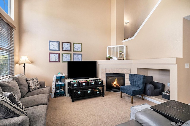 23235 York Ave, Parker, CO 80138 - living room featuring a towering ceiling, carpet floors, plenty of natural light, and a fireplace