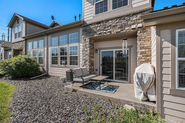 23235 York Ave, Parker, CO 80138 - back of property with stone siding and a patio