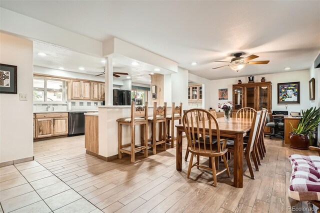 10223 W 77th Dr, Arvada, CO 80005 - dining room featuring ceiling fan, plenty of natural light, light wood finished floors, and recessed lighting