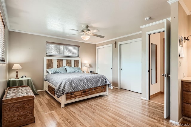 10223 W 77th Dr, Arvada, CO 80005 - bedroom featuring two closets, light wood-style flooring, ornamental molding, and ceiling fan