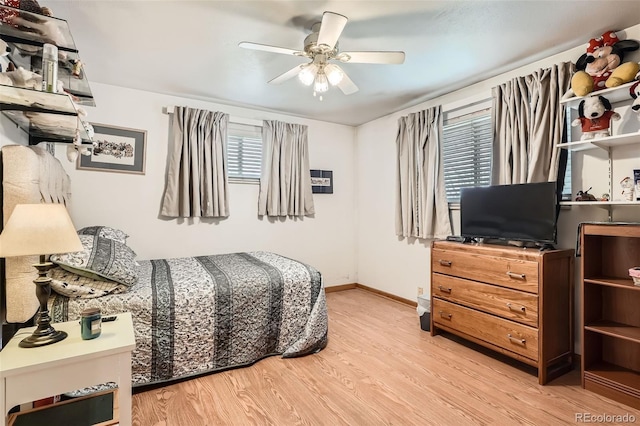10223 W 77th Dr, Arvada, CO 80005 - bedroom featuring wood finished floors and a ceiling fan