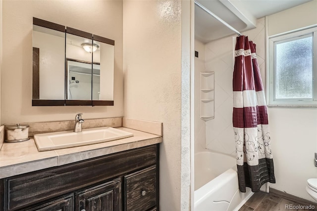 10223 W 77th Dr, Arvada, CO 80005 - bathroom featuring vanity, shower / bathtub combination with curtain, wood finished floors, and a textured wall