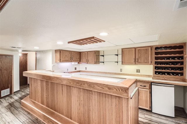 10223 W 77th Dr, Arvada, CO 80005 - kitchen with open shelves, refrigerator, light wood-type flooring, and recessed lighting