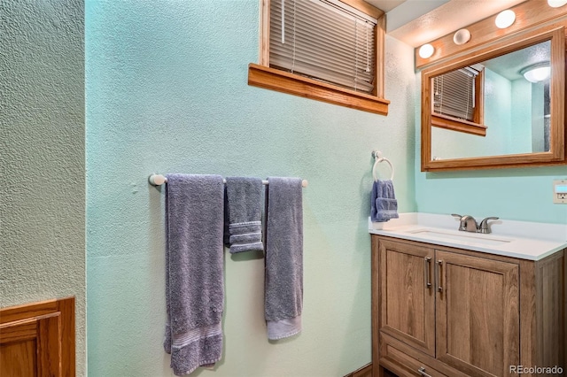 10223 W 77th Dr, Arvada, CO 80005 - bathroom featuring vanity and a textured wall