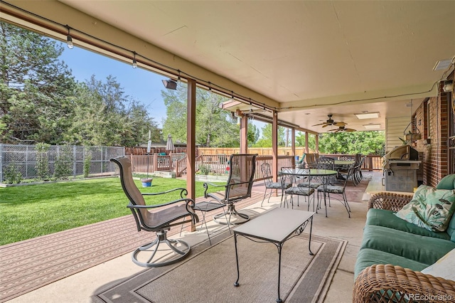 10223 W 77th Dr, Arvada, CO 80005 - fenced backyard featuring outdoor lounge area, outdoor dining space, grilling area, a patio area, and a ceiling fan