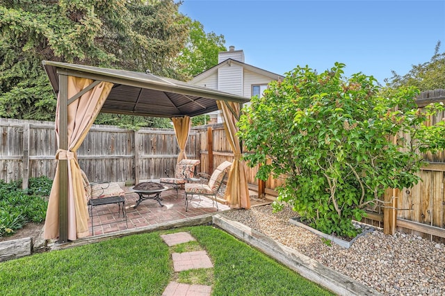 10223 W 77th Dr, Arvada, CO 80005 - fenced backyard with a gazebo, an outdoor fire pit, and a patio area