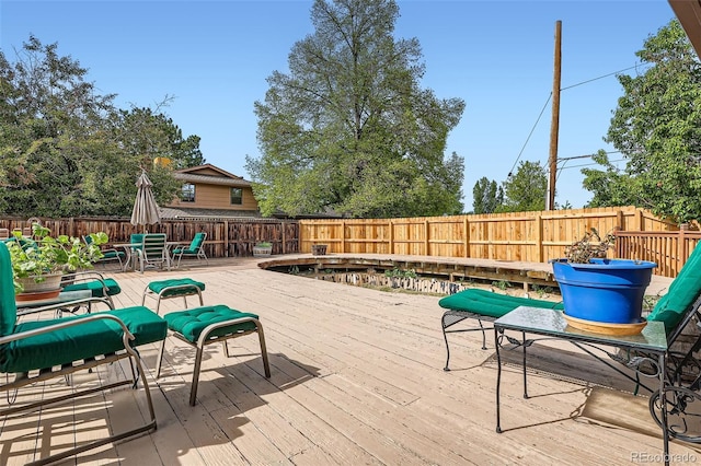 10223 W 77th Dr, Arvada, CO 80005 - deck featuring a fenced backyard and outdoor dining area