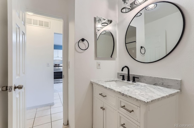 bathroom with vanity and tile patterned floors