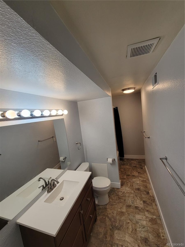 16359 W 10th Ave Unit Yy2, Golden, CO 80401 - bathroom featuring vanity and stone finish floors