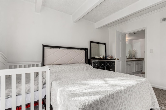 carpeted bedroom featuring beam ceiling, visible vents, a textured ceiling, and baseboards