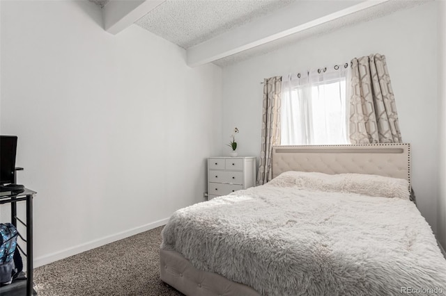 carpeted bedroom featuring beam ceiling, baseboards, and a textured ceiling