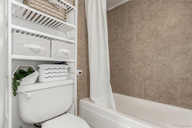 full bathroom featuring shower / tub combo and toilet