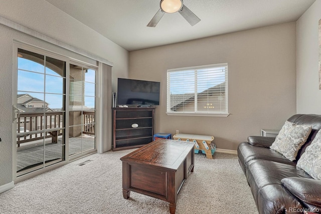 6132 Cubbage Dr, Colorado Springs, CO 80924 - carpeted living room with visible vents, baseboards, and ceiling fan
