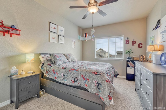 6132 Cubbage Dr, Colorado Springs, CO 80924 - bedroom featuring a textured wall, light carpet, baseboards, and ceiling fan
