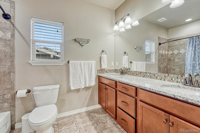 6132 Cubbage Dr, Colorado Springs, CO 80924 - bathroom featuring toilet, a sink, double vanity, and visible vents