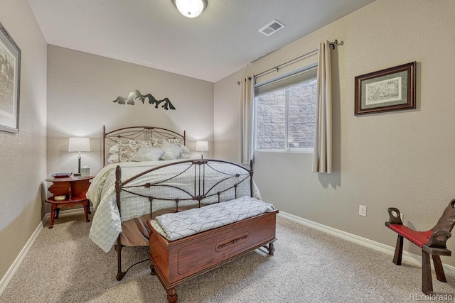 6132 Cubbage Dr, Colorado Springs, CO 80924 - carpeted bedroom with baseboards, a textured wall, and visible vents