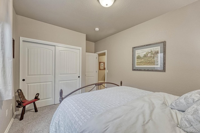 6132 Cubbage Dr, Colorado Springs, CO 80924 - carpeted bedroom featuring a closet, a textured ceiling, and baseboards
