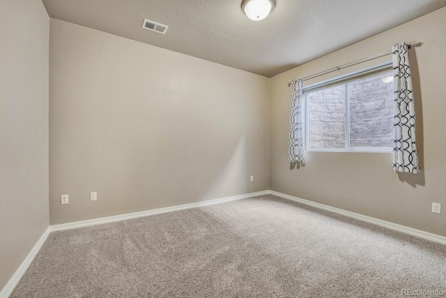 6132 Cubbage Dr, Colorado Springs, CO 80924 - spare room featuring baseboards, visible vents, carpet floors, and a textured ceiling