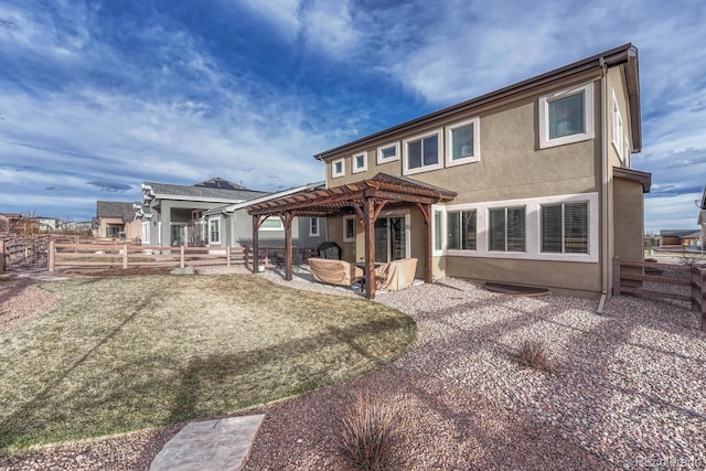 6132 Cubbage Dr, Colorado Springs, CO 80924 - back of house with a pergola, fence, stucco siding, and a patio area
