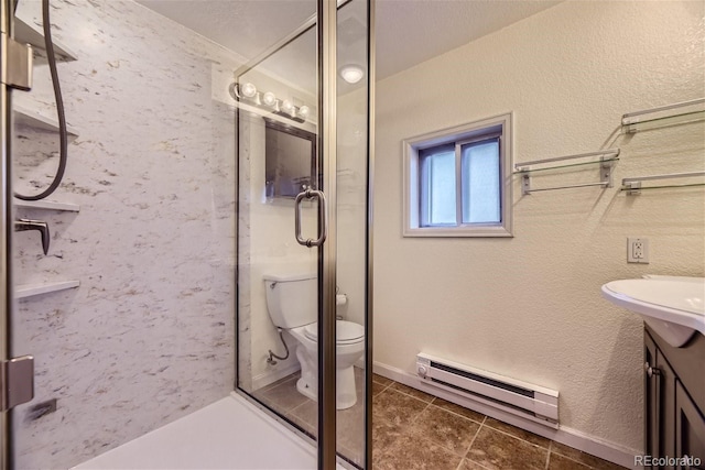 full bath with vanity, a baseboard radiator, a stall shower, toilet, and a textured wall