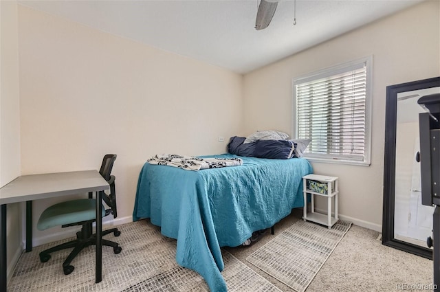 bedroom with baseboards and ceiling fan