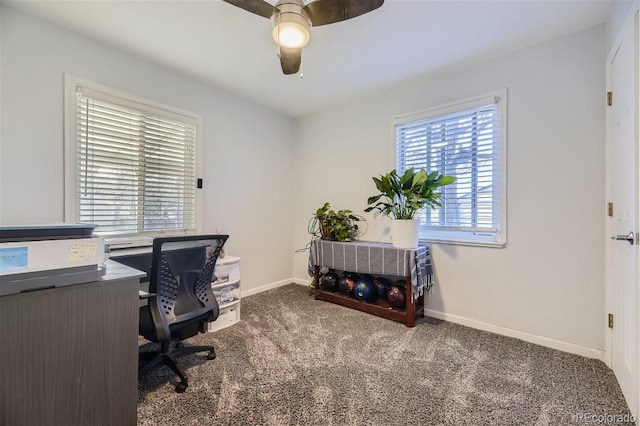 office space with carpet, baseboards, and ceiling fan