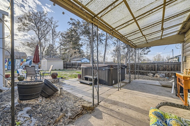 view of patio with an outbuilding, a shed, a pergola, and a fenced backyard