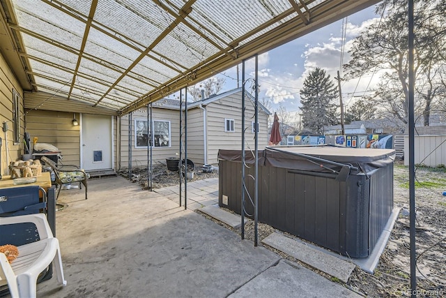 view of patio featuring a pergola and a hot tub