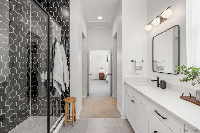 16722 Shoshone St, Broomfield, CO 80023 - bathroom featuring vanity, connected bathroom, a stall shower, tile patterned floors, and recessed lighting