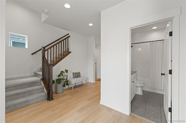16722 Shoshone St, Broomfield, CO 80023 - staircase featuring recessed lighting, wood finished floors, and baseboards