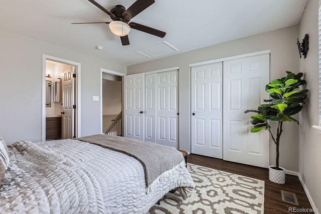 4620 E 135th Way, Thornton, CO 80241 - bedroom featuring multiple closets, attic access, dark wood-type flooring, baseboards, and a ceiling fan