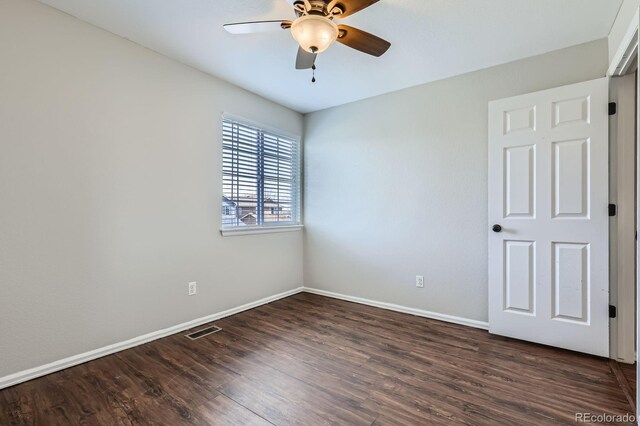 4620 E 135th Way, Thornton, CO 80241 - spare room featuring a ceiling fan, baseboards, and dark wood-type flooring