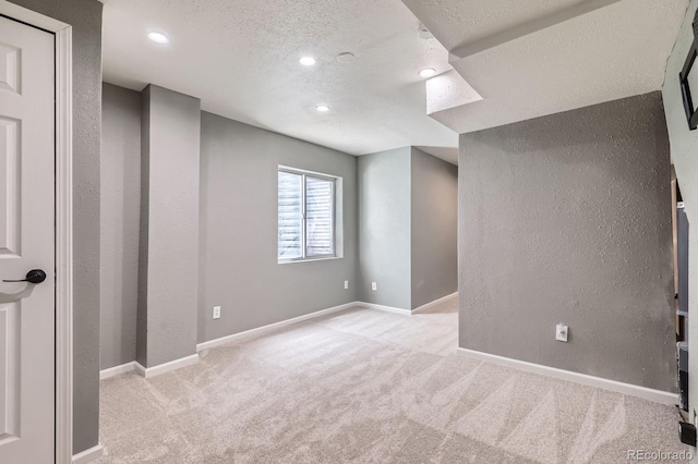 4620 E 135th Way, Thornton, CO 80241 - basement with carpet flooring, a textured ceiling, recessed lighting, a textured wall, and baseboards