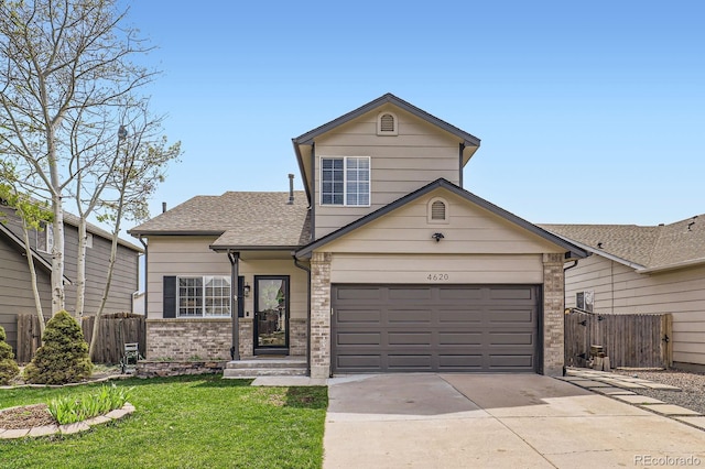 4620 E 135th Way, Thornton, CO 80241 - traditional-style home with driveway, roof with shingles, brick siding, and an attached garage