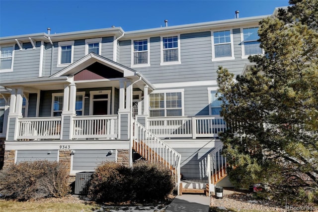 view of front of house with central AC unit and covered porch