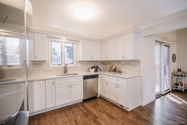 kitchen featuring a sink, dark wood-type flooring, dishwasher, and white cabinetry