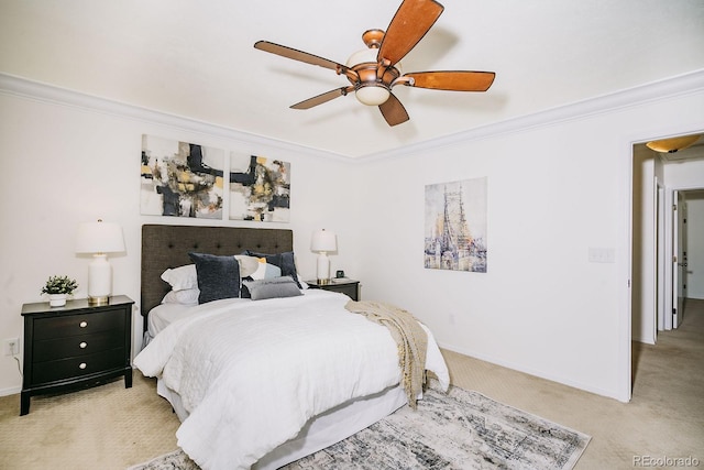 bedroom featuring light colored carpet, a ceiling fan, baseboards, and ornamental molding