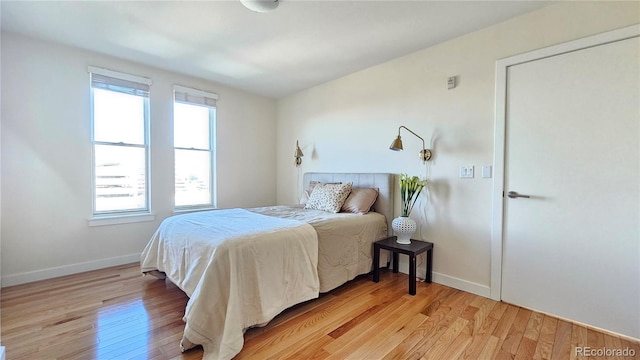 bedroom with light wood-type flooring