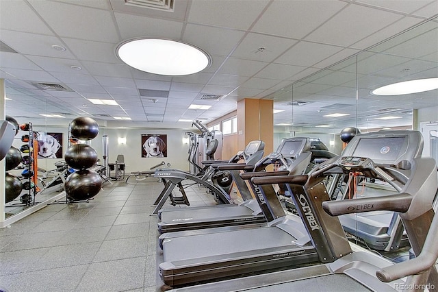 exercise room with a drop ceiling