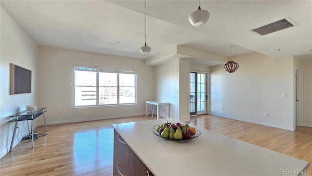 dining space featuring light wood-type flooring