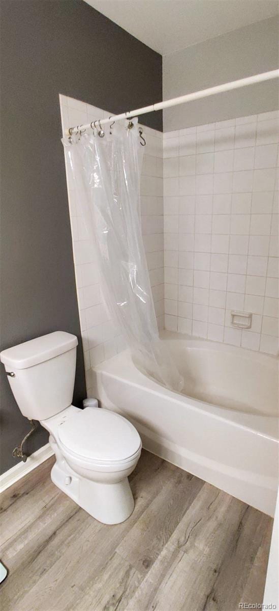 7355 S Alkire St Unit 203, Littleton, CO 80127 - bathroom with wood finished floors and shower / bath combination with curtain
