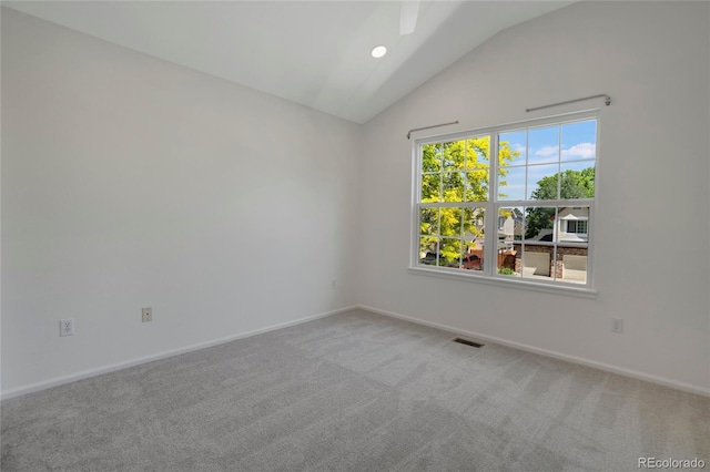 6054 W Adriatic Pl, Lakewood, CO 80227 - spare room featuring vaulted ceiling, carpet floors, and baseboards